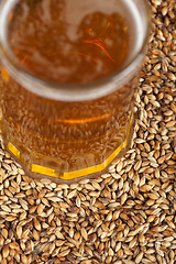 Image showing beer glass at malt grains