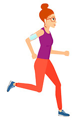 Image showing Woman jogging with earphones and smartphone.