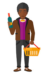 Image showing Customer with shopping basket and bottle of wine.