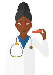 Image showing Pharmacist showing some medicine.