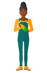 Image showing Farmer holding corn.