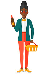 Image showing Customer with shopping basket and bottle of wine.