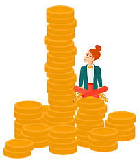 Image showing Business woman sitting on gold.