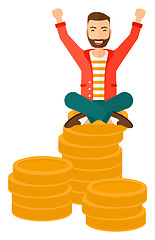 Image showing  Happy businessman sitting on coins.