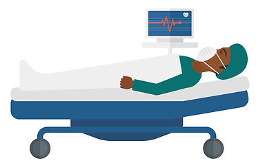 Image showing Patient lying in bed with heart monitor.