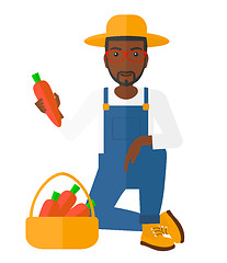 Image showing Farmer collecting carrots.