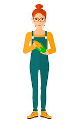 Image showing Farmer holding corn.