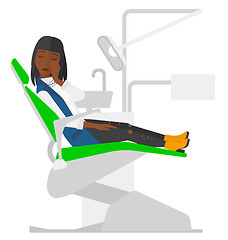 Image showing Woman suffering in dental chair.