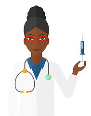 Image showing Doctor holding syringe.