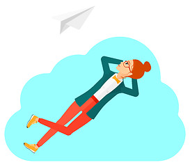 Image showing Business woman relaxing on cloud.