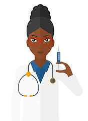 Image showing Doctor holding syringe.