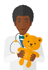 Image showing Pediatrician holding teddy bear.