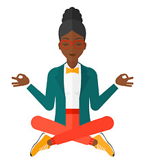 Image showing Business woman meditating in lotus pose.