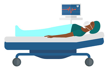 Image showing Patient lying in bed with heart monitor.