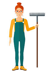 Image showing Farmer with rake.