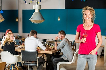 Image showing Beautiful Woman Holding Wineglass At Cafe