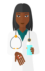 Image showing Pharmacist giving pills.