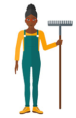 Image showing Farmer with rake.