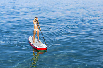 Image showing Woman practicing paddle