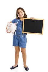 Image showing Girl holding a piggybank