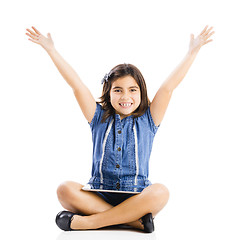 Image showing Young girl using a tablet