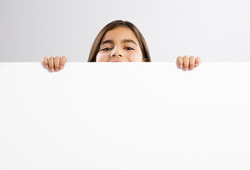 Image showing Girl holding a whiteboard