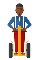 Image showing Man riding on segway.