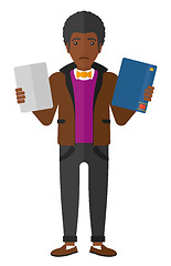 Image showing Man choosing between book and tablet.