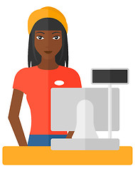 Image showing Saleslady standing at checkout.