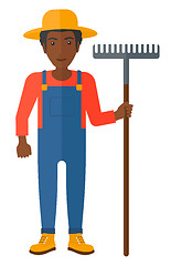 Image showing Farmer with rake.