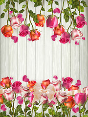 Image showing Roses and a hearts on wooden board. EPS 10