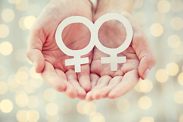 Image showing close up of happy lesbian couple with venus symbol