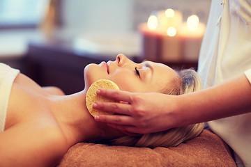 Image showing close up of woman having face massage in spa