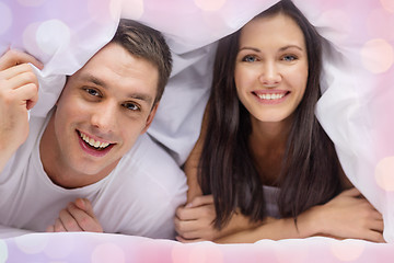 Image showing happy couple sleeping in bed