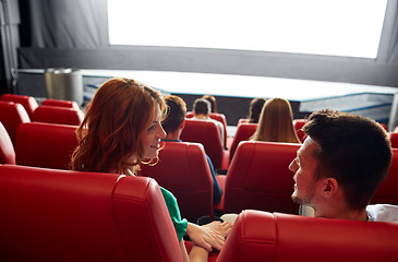 Image showing happy couple watching movie in theater or cinema