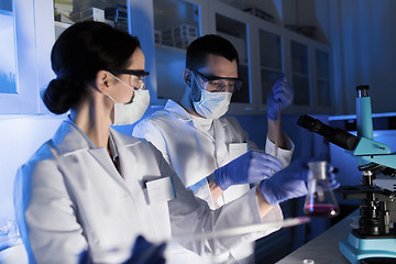 Image showing close up of scientists making test in lab