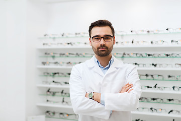 Image showing man optician in glasses and coat at optics store