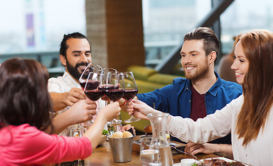 Image showing friends dining and drinking wine at restaurant