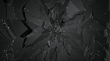 Image showing Pieces of splitted or shattered glass on black