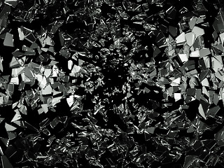 Image showing Shattered pieces of glass on black