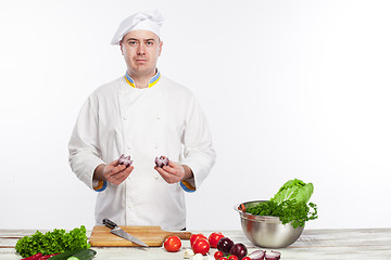 Image showing Chef cooking fresh vegetable salad in his kitchen