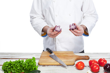 Image showing Chef cooking fresh vegetable salad in his kitchen