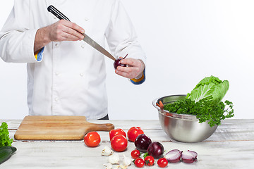 Image showing Chef cooking fresh vegetable salad in his kitchen