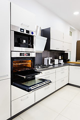 Image showing Modern hi-tek kitchen, oven with door open