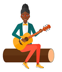 Image showing Woman playing guitar.