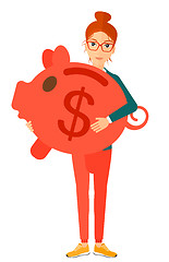 Image showing Woman carrying piggy bank.