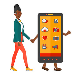 Image showing Woman walking with smartphone.