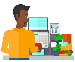 Image showing Cashier at supermarket checkout.