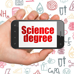 Image showing Science concept: Hand Holding Smartphone with Science Degree on display