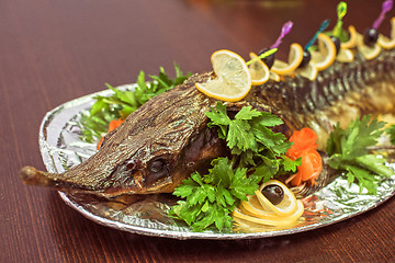 Image showing sturgeon baked with greens